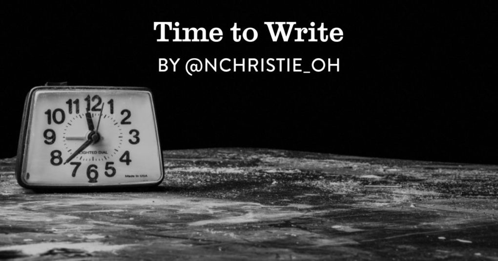 Alarm clock sits on a table to the left of the frame and the post title, "Time to Write' is superimposed on the right. 
