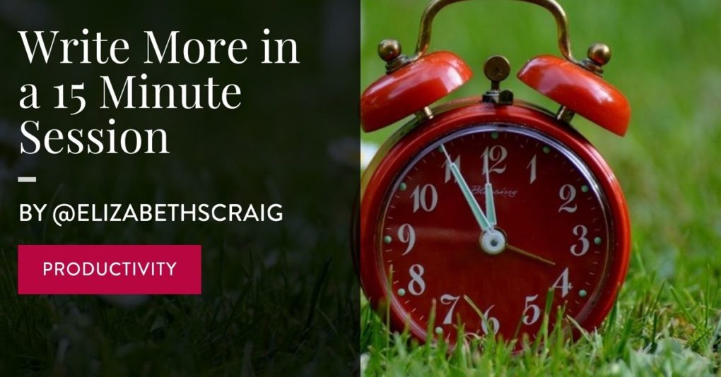 A red alarm clock sits on a grassy background.