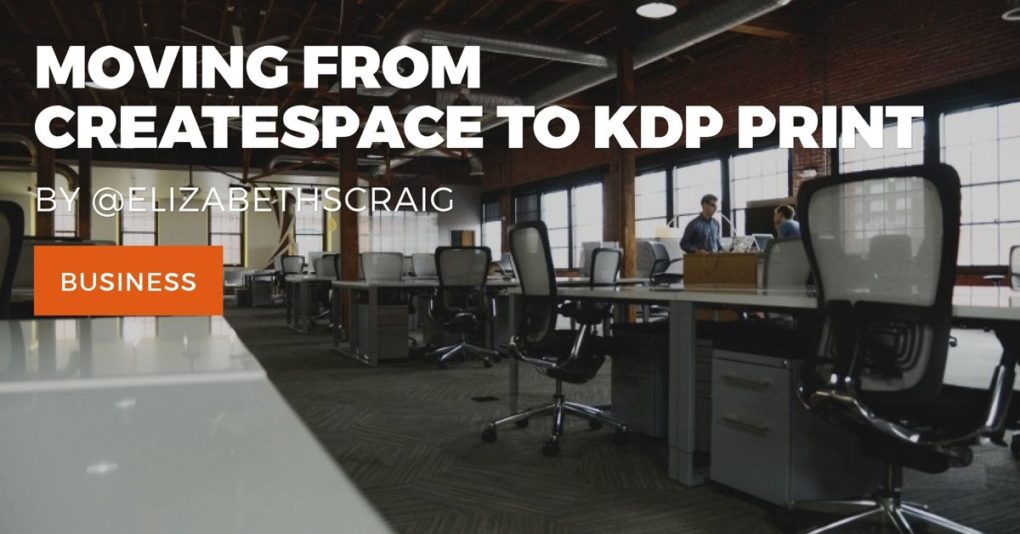 Large, warehouse style office with coworkers talking in the background.